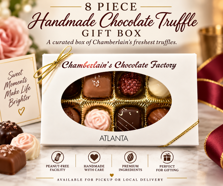 Chamberlain's Chocolate Factory 8-piece artisan chocolate truffle gift box with gold bow — sea salt caramel, raspberry, rose, and dark chocolate truffles visible through oval window, crafted in Atlanta, Georgia