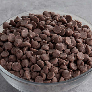 Allergen Friendly Vegan Milk Chocolate Chips in a glass bowl, perfect for baking and enjoying allergen-free desserts.