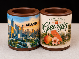 Set of 2 solid chocolate shot glasses  — one with Atlanta skyline edible print, one with Georgia Peach State design from Chamberlains Chocolate Atlanta