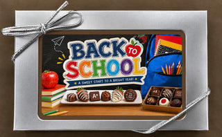 Back to School chocolate bar in a silver gift box with colorful edible image, made at Chamberlain's Atlanta studio in a peanut-free facility