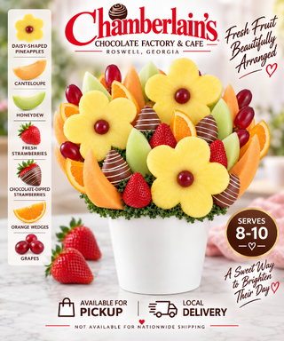 Happy birthday fresh fruit bouquet with pineapple flower cutouts, cantaloupe, green grapes, strawberries, and chocolate covered strawberries in a white gift bucket — artisan birthday fruit arrangement from Chamberlain's Chocolate Factory in Roswell, Georgia