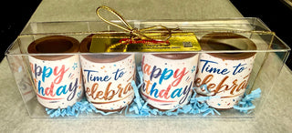 Set of 4 solid chocolate shot glasses with colorful multicolor edible 'Happy Birthday' and 'Time to Celebrate' prints, in a clear gift box with gold ribbon and Chamberlain's Chocolate label, Roswell Georgia