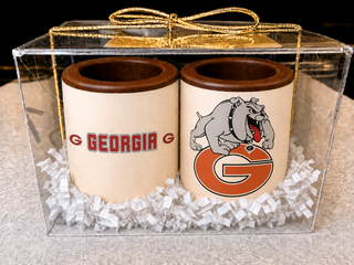 Set of 2 milk chocolate shot glasses with Georgia Bulldogs edible print — one with team name, one with logo — gift boxed in a clear acrylic box with silver bow, made at Chamberlain's in Roswell, GA