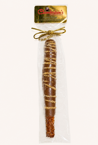 Milk Chocolate covered pretzel rods, each gift packaged in a clear bag with a gold bow. Chamberlains Chocolate Factory in Atlanta