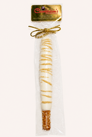 White Chocolate covered pretzel rods, each gift packaged in a clear bag with a gold bow. Chamberlains Chocolate Factory in Atlanta