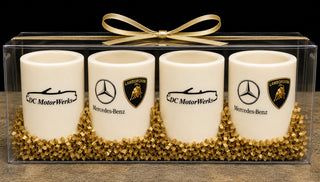 Set of 4 custom white chocolate shot glasses with gold ribbon bow, premium corporate gift crafted at Chamberlain's Chocolate, Roswell GA