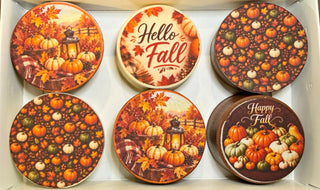 Six Halloween chocolate-covered Oreos with edible Boo, Happy Halloween, ghost, pumpkin, and mummy designs