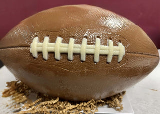 Milk Chocolate Life Size Football with white chocolate strings, filled with chocolate drizzled popcorn.