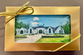Custom Printed Business Size Chocolate Bars With Logo Dozen in a gold box with a ribbon and a house image.
