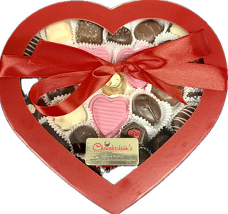 Two Pound Valentine Heart Chocolate Box with assorted chocolates and a red ribbon in a heart-shaped box.