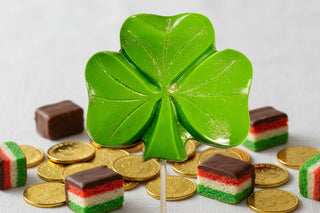Huge Hand Molded Chocolate Shamrock Lollipop with gold coins and chocolate treats for St. Patrick's Day.