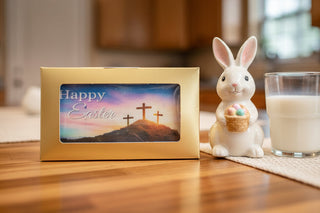 Easter Hand Molded Small Chocolate Bar With Image beside a bunny figurine and a glass of milk.
