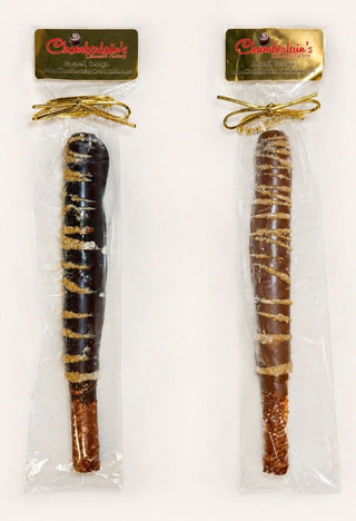 Dark and Milk Chocolate covered pretzel rods, each gift packaged in a clear bag with a gold bow. Chamberlains Chocolate Factory in Atlanta