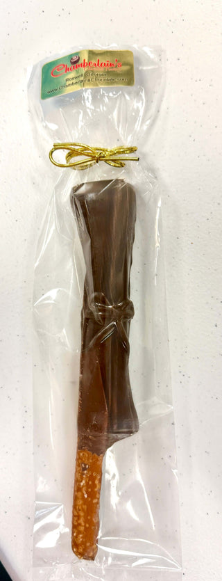 Graduation Chocolate Covered Pretzel Rods wrapped in clear packaging with a decorative bow.