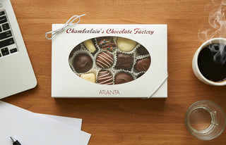 Chamberlain's Chocolate Half Pound Classic Assortment Box with assorted chocolates on a wooden table