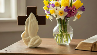 Hand-Molded Chocolate Cross with Praying Hands featuring white chocolate praying hands on a brown chocolate cross.