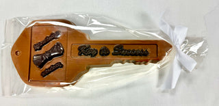 Hand-Molded Milk Chocolate Key to Success in a gift bag, celebrating achievements with a delicious treat.