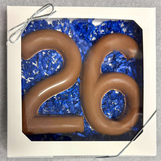 Chocolate number '26' on blue decorative paper