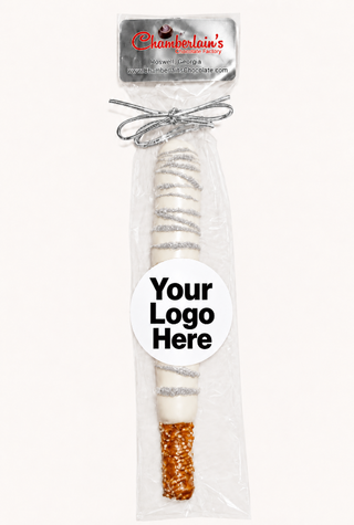 White Milk Chocolate dipped and drizzled with silver shimmer pretzel rods individually wrapped with your branding logo image