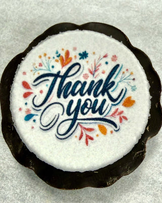 Custom Printed Small Chocolate Pieces with colorful 'Thank You' edible logo design on dark chocolate.