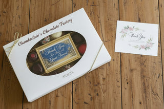 Thank You Tenant Chocolate Bar and Assortment in a gift box with assorted chocolates and a thank you card.