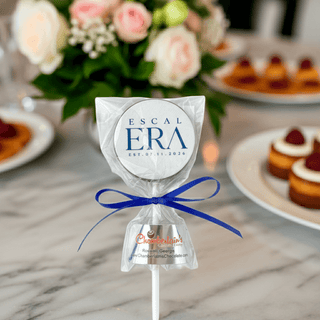  Custom chocolate lollipop with corporate logo edible image in clear cello bag with blue ribbon, branded gourmet chocolate favor from Chamberlain's Chocolate Factory Roswell GA