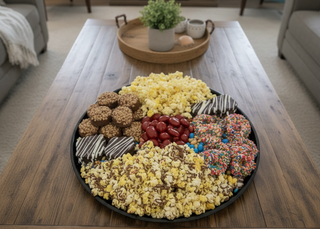 Chocolate Snacks Platter Assorted Sweet and Savory Treats featuring popcorn, chocolate cookies, and cand