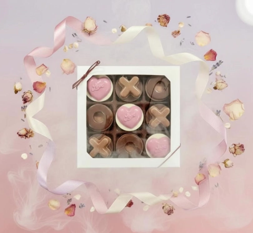 Nine Valentine Love Chocolate Oreos and Molded Chocolates featuring chocolate Xs, Os, and pink love hearts.